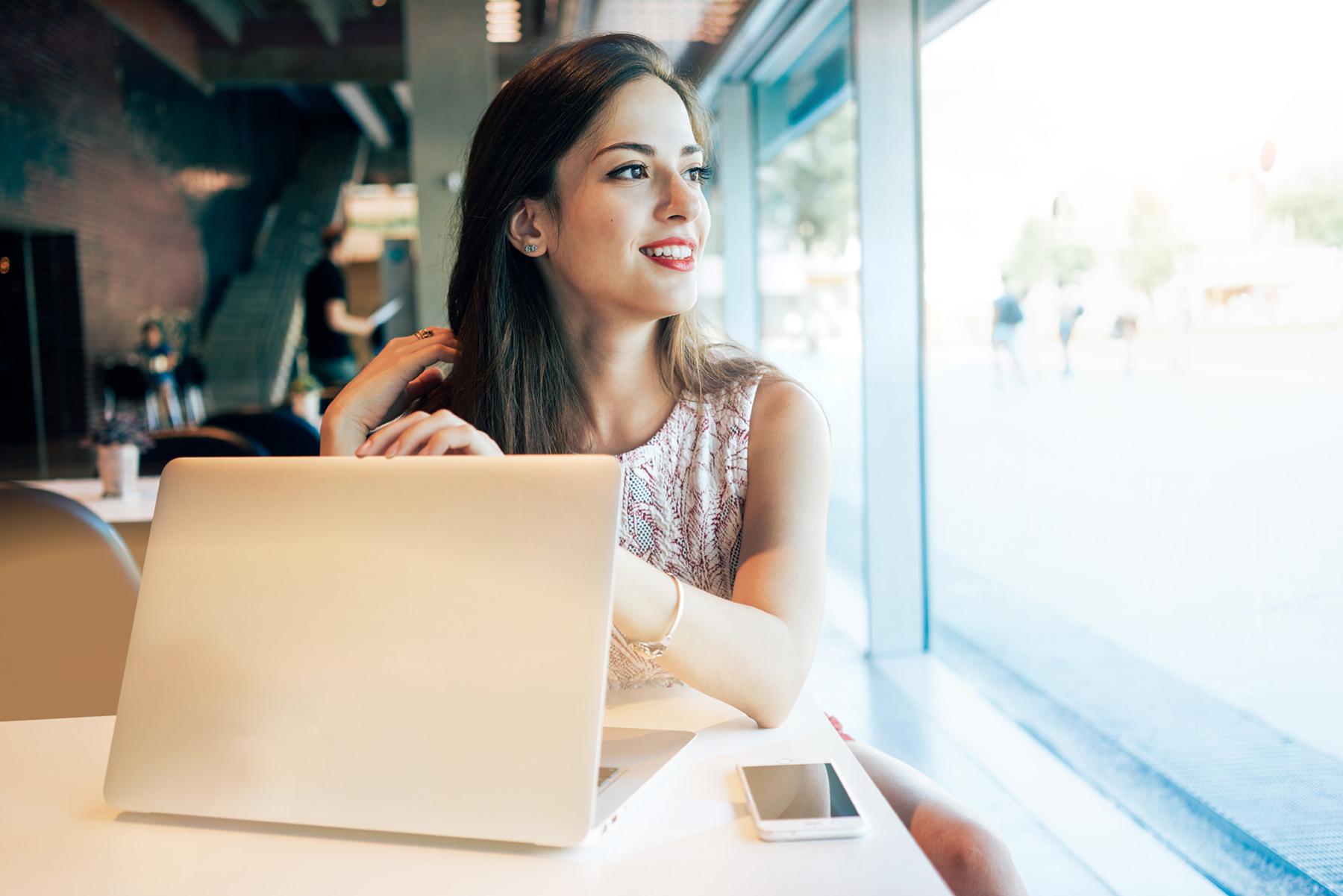 woman staring out window